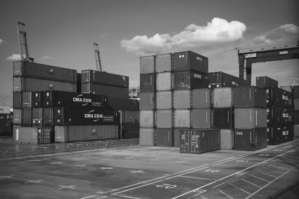 Containers stacked by a crane