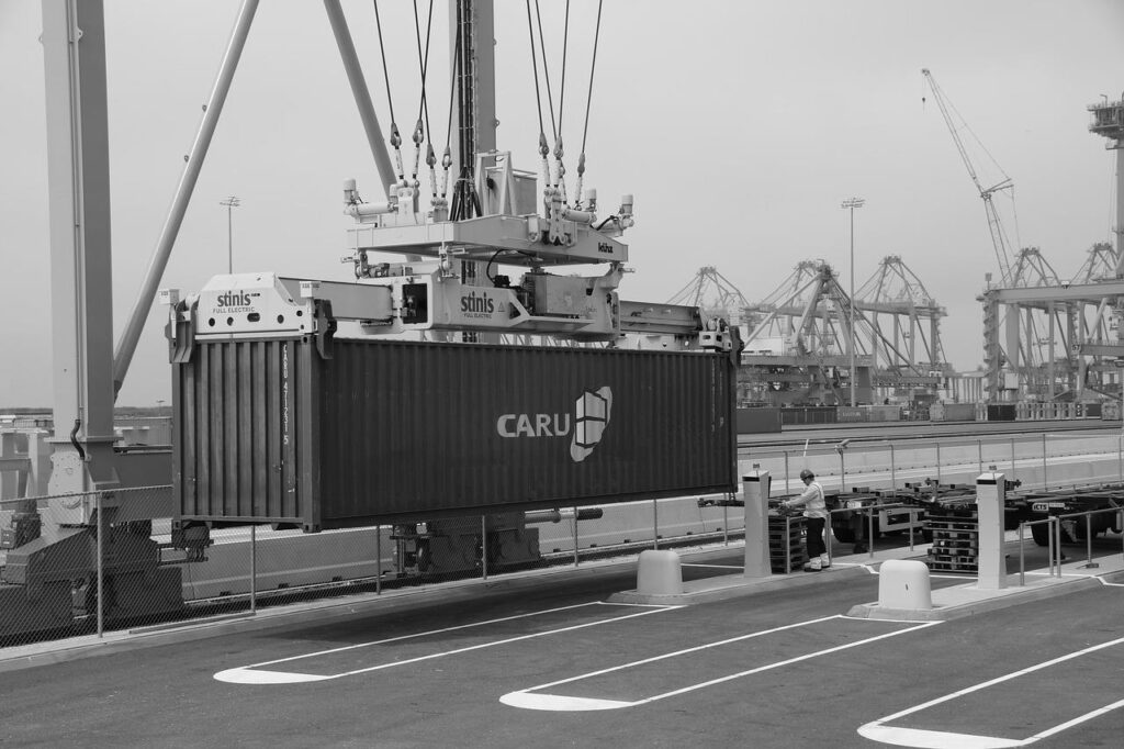 Container being lifted by a crane